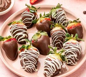 nutella covered strawberries, In a plate full of Nutella covered strawberries with pink background Nutella is placed in a bowl in the side