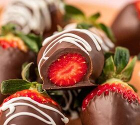 nutella covered strawberries, Strawberry covered in nutella and dark chocolate and bite taken to see inside