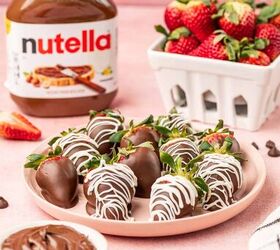 nutella covered strawberries, Nutella coveres strawberries in a pink plate and pink background nutella product in the behind along with the fresh strawberries