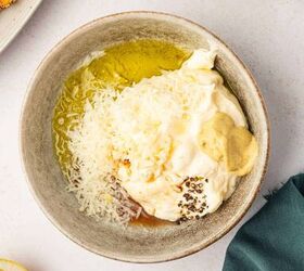 crispy chicken caesar salad, Caesar salad dressing ingredients added to the bowl