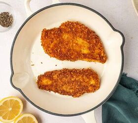 crispy chicken caesar salad, In a large white skillet the crispy chicken is prepared in batches for caesar salad recipe