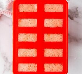 healthy homemade strawberry popsicles recipe, Blending strawberry mixture in a popsicle mold