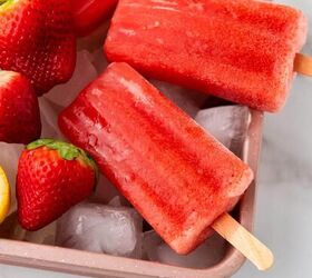 healthy homemade strawberry popsicles recipe, Strawberry popsicles with cut lemons on a tray