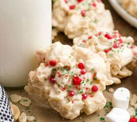 caramel cheesecake bars, Red and green decorated rice krispie cookies next to a carafe of milk on a piece of parchment paper