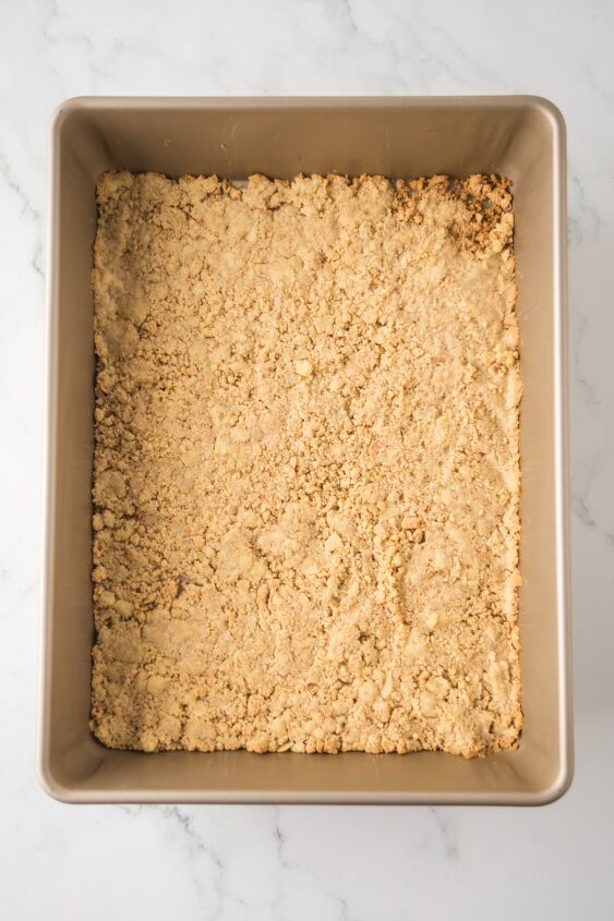 caramel cheesecake bars, Crushed graham crackers packed into a baking dish