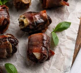 prosciutto wrapped dates, Dates sitting on parchment paper