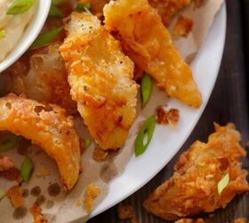 onion petals air fryer onion petal recipe, Onion Petals on a white plate with dipping sauce