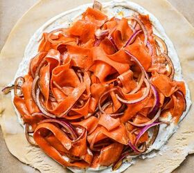 spicy carrot feta galette, Carrot ribbon and onion mixture on top of the filling layer on a pie crust