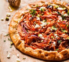 spicy carrot feta galette, Spicy carrot and feta galette on a wooden board lined with parchment paper