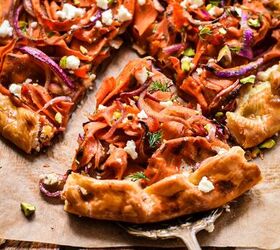 spicy carrot feta galette, Metal pie spatula taking a slice of the spicy carrot and feta galette