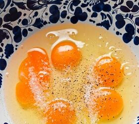 spanish zucchini tortilla, Eggs in a mixing bowl with salt and pepper on top
