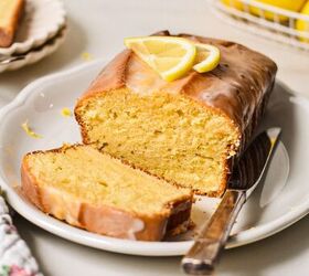 lemon loaf cake, Lemon loaf cake on a white plate with a slice off the end