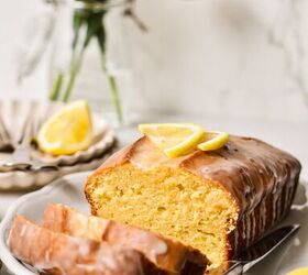 lemon loaf cake, Lemon loaf cake on a serving plate with two slices off the end