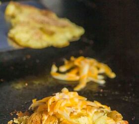 smashed potatoes with cheese, Smashed potato with Colby Jack cheese on top and one getting the extra cheese option for a crispier cheesier crust