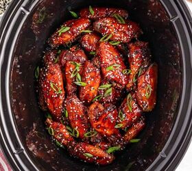 easy slow cooker korean chicken wings recipe, Savory Korean chicken wings adorned with sesame seeds and green onions