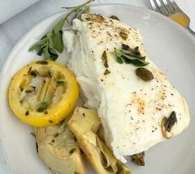 chickpea cucumber feta salad, A slice of the halibut on a plate with the lemon caper artichoke sauce over the top