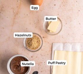 nutella in puff pastry, Ingredients include puff pastry Nutella hazelnuts butter and egg