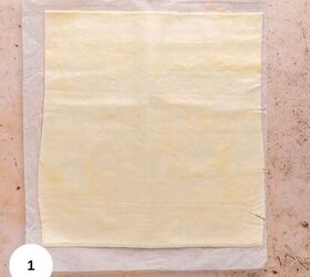 nutella in puff pastry, A sheet of puff pastry laid out on the counter while still sitting on parchment paper