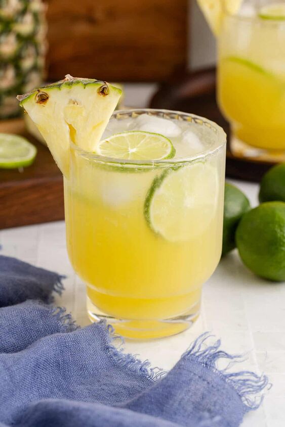 pineapple rum cocktail, Pineapple Rum Cocktail with a Pineapple and Lime garnish