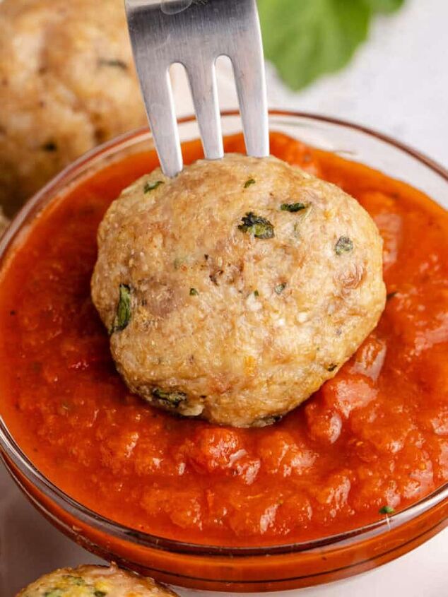pineapple rum cocktail, Costco Chicken Meatballs on a Fork being Dipped in to Marinara