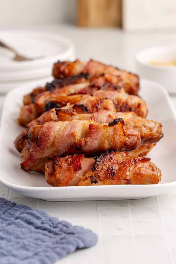 15 quick easy air fryer recipes youll want to make on repeat, Bacon Wrapped Sausage in Air Fryer
