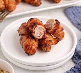bacon wrapped sausage in air fryer, Bacon Wrapped Sausage in Air Fryer on a plate one cut in half