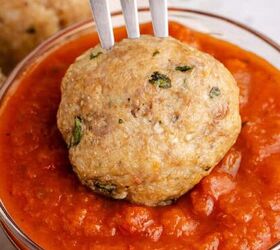 bacon wrapped sausage in air fryer, Costco Chicken Meatballs on a Fork being Dipped in to Marinara