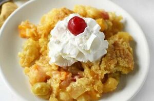 What do you get when you mix canned fruit cocktail and yellow cake mix? The best darn fruit cocktail dump cake EVER