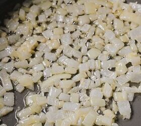 cajun crab spinach artichoke dip, Onions and garlic cooking in butter in a skillet