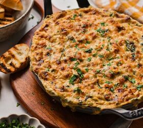 cajun crab spinach artichoke dip, Cajun crab spinach artichoke dip in a cast iron skillet topped with melted cheese
