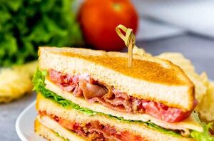 This hearty chicken club sandwich is stacked to perfection!