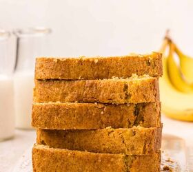 cake mix banana bread, A stack of five slices of cake mix banana bread on a white cutting board In the background there are two glass bottles of milk and some bananas A striped cloth is partially visible in the foreground