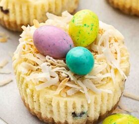 high protein banana split yogurt recipe for breakfast, Mini Easter cheesecakes arranged on a decorative serving plate with bright candy eggs on top