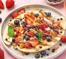 high protein banana split yogurt recipe for breakfast, Refreshing yogurt banana split with fresh raspberries blueberries and a dollop of Greek yogurt