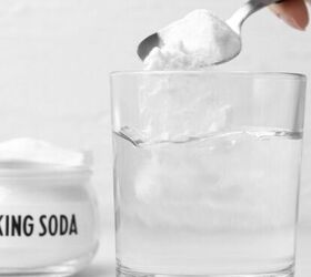 5 ingredient lemon white chocolate cookies with cake mix, Baking soda in a clear glass with a silver spoon resting inside ready for use in cooking or baking