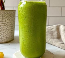 bahama mama smoothie tropical smoothie cafe copycat, A green smoothie in a glass with tropical fruit surrounding the drink