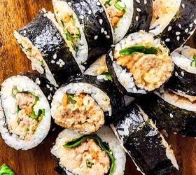 easy red bean soup instant pot recipe you must try, Tuna kimbap on a brown cutting board with a few spinach leaves on the side
