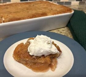 sourdough apple pie cobbler with fresh milled flour, a serving of apple pie cobbler topped with whipped cream on a plate next to the pan