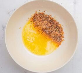 oven baked blackened salmon recipe, Melted butter and blackened seasoning in a small bowl