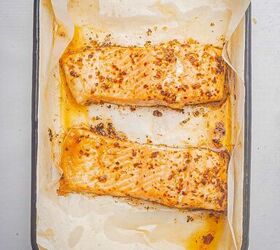 oven baked blackened salmon recipe, Baked blackened salmon in a baking dish with parchment paper