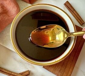 brown sugar simple syrup, A brown cinnamon simple syrup in a bowl with a golden spoon