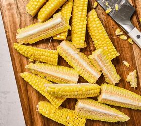 pesto butter corn ribs, Sliced corn from the cob on a wooden board