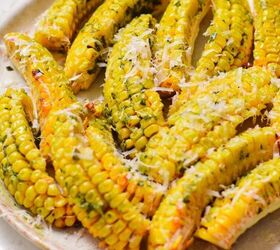 pesto butter corn ribs, Side view of crispy corn ribs with pesto butter and parmesan on top