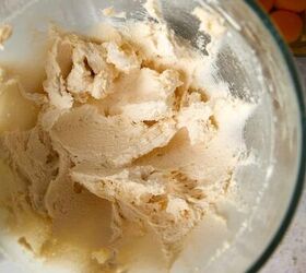 easy peach cobbler pound cake with brown butter glaze, looking down peach cobbler pound cake batter in a mixing bowl after butter and sugar has been creamed until light and fluffy
