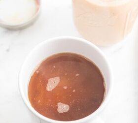 homemade pumpkin spice coffee creamer recipe, A cup filled with homemade pumpkin flavored creamer and a black coffee