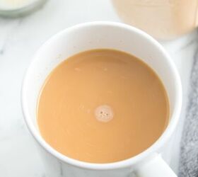 homemade pumpkin spice coffee creamer recipe, A white cup of coffee filled with homemade pumpkin flavored creamer