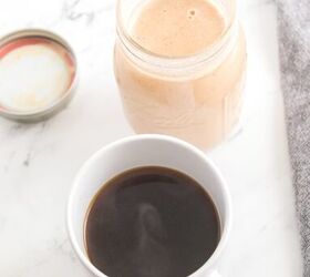 homemade pumpkin spice coffee creamer recipe, A cup filled with homemade pumpkin flavored creamer and a black coffee