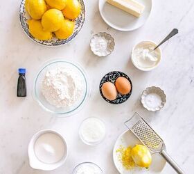 starbucks copycat lemon loaf, Baking ingredients including lemons eggs flour sugar butter and vanilla arranged on a white countertop