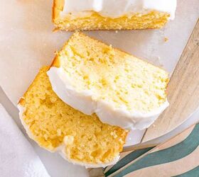 starbucks copycat lemon loaf, Sliced lemon loaf cake with white icing on a marble board next to a green striped napkin