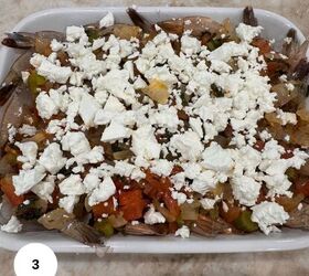 mediterranean greek shrimp with feta and tomatoes, Putting the shrimp in the casserole dish and topping it with the tomato mixture and feta cheese